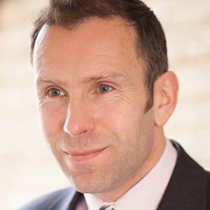 Head shot of Ben Hughes looking away from camera