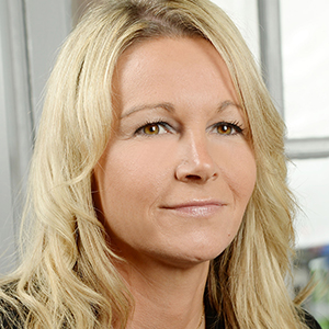 Head shot of Gillian Christian smiling and looking away from camera