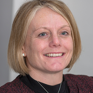 Head shot of Sally Cranshaw smiling and looking away from camera