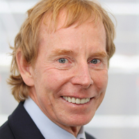 Head shot of Andrew Watson smiling into camera