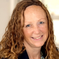 Head shot of Anna McKibbin smiling into camera