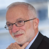 Head shot of Antony Colman smiling and looking away from camera