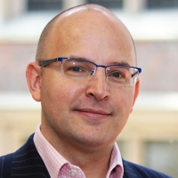 Head shot of Benjamin Maltby smiling into camera