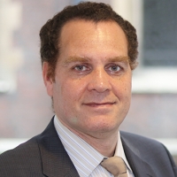 Head shot of Bruno Fatier looking into camera