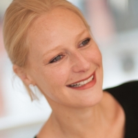 Head shot of Ceinwen Lloyd smiling and looking away from camera