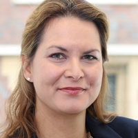 Head shot of Chrissie Cuming Walters smiling into camera