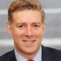 Head shot of Christopher Gabbitas smiling into camera