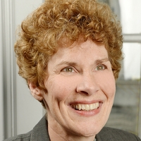 Head shot of Cordelia Rushby smiling and looking away from camera