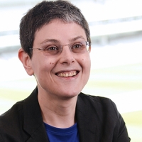 Head shot of Deborah Brown smiling and looking away from camera