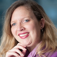 Head shot of Eleanor Richardson smiling and looking away from camera