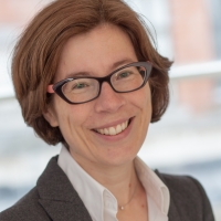 Head shot of Fiona Macdonald smiling and looking away from camera