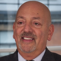 Head shot of Garry Turkie smiling and looking away from camera