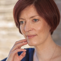 Head shot of Gillian Cordall looking away from camera