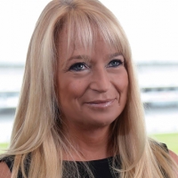 Head shot of Helen Sherborne smiling and looking away from camera