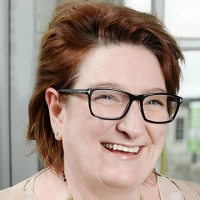 Head shot of Hilary O'Connor smiling and looking away from camera