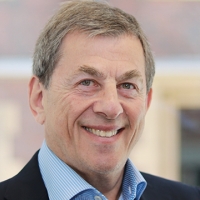 Head shot of Howard Waterman smiling into camera