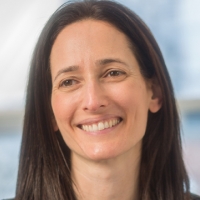 Head shot of Ilana Swimer smiling and looking away from camera