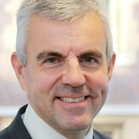 Head shot of James Crabtree smiling into camera