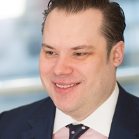 Head shot of James Goff smiling and looking away from camera