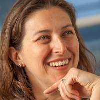 Head shot of Joanna McKenzie smiling and looking away from camera