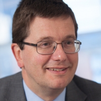 Head shot of John Pears smiling and looking away from camera