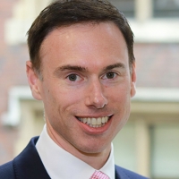 Head shot of Jonathan Watmough smiling into camera