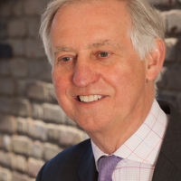 Head shot of Lance Feaver smiling and looking away from camera