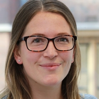 Head shot of Lizzie Goulden smiling into camera