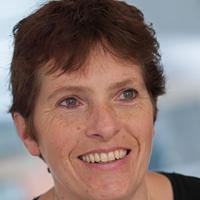 Head shot of Louise Grendon smiling and looking away from camera