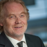 Head shot of Mark Dent smiling and looking away from camera