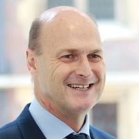 Head shot of Nigel Forsyth smiling and looking away from camera