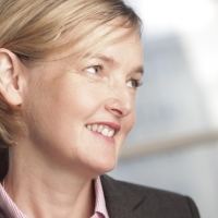 Head shot of Rachel Flynn smiling and looking away from camera