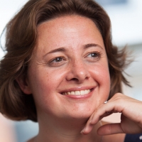 Head shot of Rachel Tozer smiling and looking away from camera