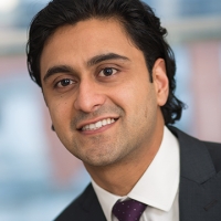 Head shot of Rahul Rajput smiling and looking away from camera