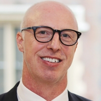 Head shot of Richard Collins smiling into camera