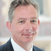 Head shot of Robert Kilgour smiling into camera