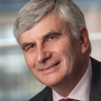 Head shot of Robert Sutherland smiling and looking away from camera