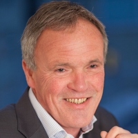 Head shot of Ronan Speers smiling and looking away from camera