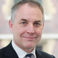 Head shot of Stuart Robertson smiling into camera