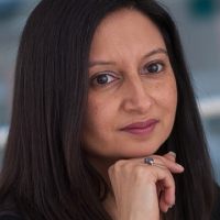 Head shot of Susan Anand looking away from camera