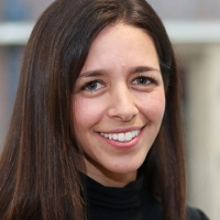 Head shot of Tara Grossman smiling into camera