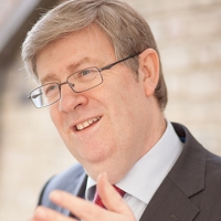 Head shot of Tony Watts smiling and looking away from camera