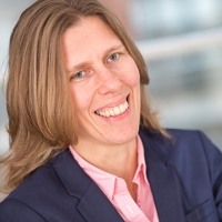 Head shot of Vanessa Barnett smiling and looking away from camera