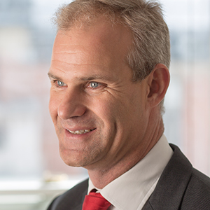 Head shot of Doug Rofe smiling and looking away from camera