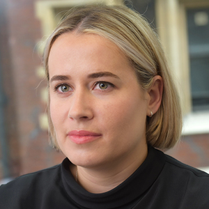 Head shot of Emma Millar looking away from camera