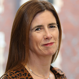 Head shot of Maureen Kelly smiling into camera