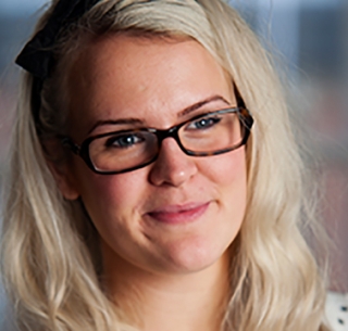 Head shot of Amy Murphy smiling and looking away from camera