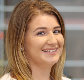 Head shot of Lizzie Dinmore smiling into camera