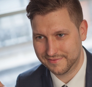 Head shot of Luke Trokielewicz looking away from camera