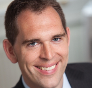 Head shot of William Robins smiling into camera